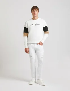 Pantaloni cinque tasche in cotone con strappi