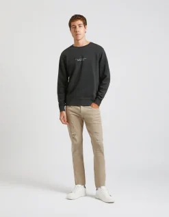 Pantaloni cinque tasche in cotone con strappi