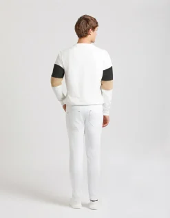 Pantaloni cinque tasche in cotone con strappi